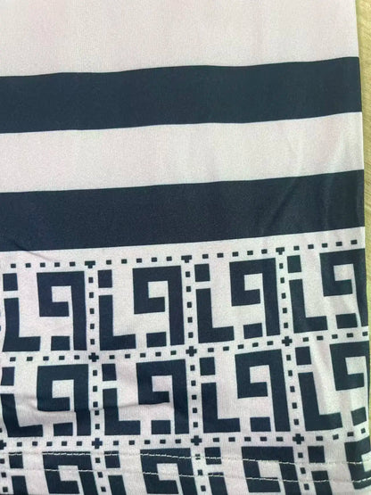 Plus-size women's short-sleeved round-neck pocket dress with geometric ethnic pattern print and loose fit.