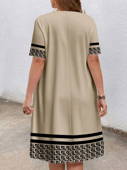 Plus-size women's short-sleeved round-neck pocket dress with geometric ethnic pattern print and loose fit.