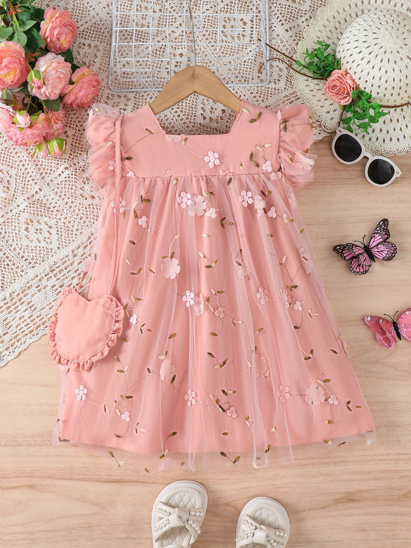 Baby girl flower embroidered mesh dress with bow tie and strap design, suitable for spring and summer when paired with a bag