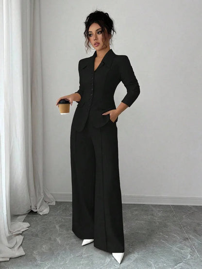 Solid-color button-down front shirt. Casual drop-shoulder long-sleeve top paired with trousers. A women's casual set suitable fo