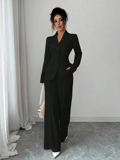 Solid-color button-down front shirt. Casual drop-shoulder long-sleeve top paired with trousers. A women's casual set suitable fo
