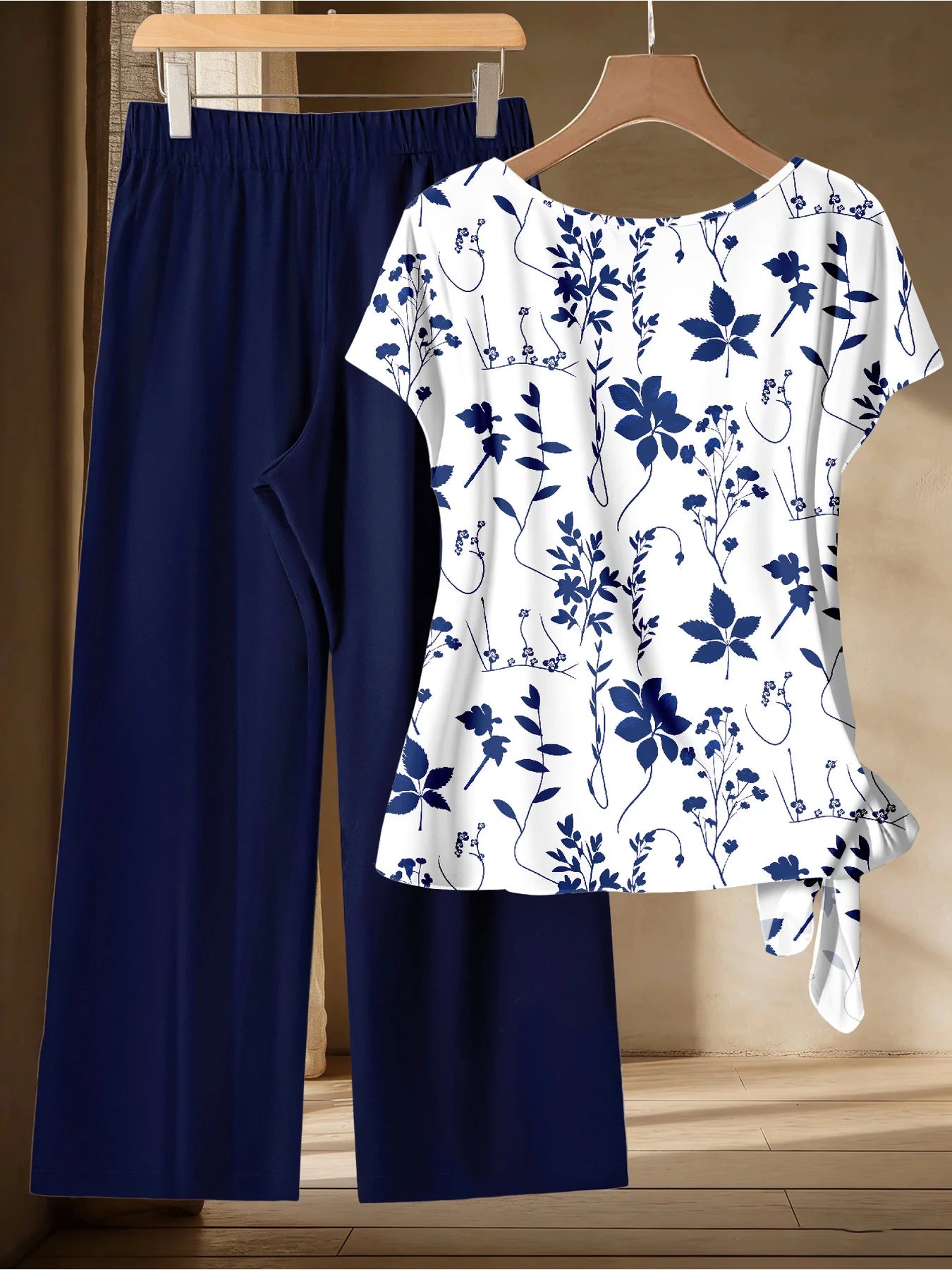 Summer Comfortable and Casual Women's Plus Size White Plant Pattern Twisted Top, Navy Blue Wide Leg Pants Set, Two-Piece Set