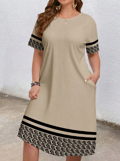 Plus-size women's short-sleeved round-neck pocket dress with geometric ethnic pattern print and loose fit.